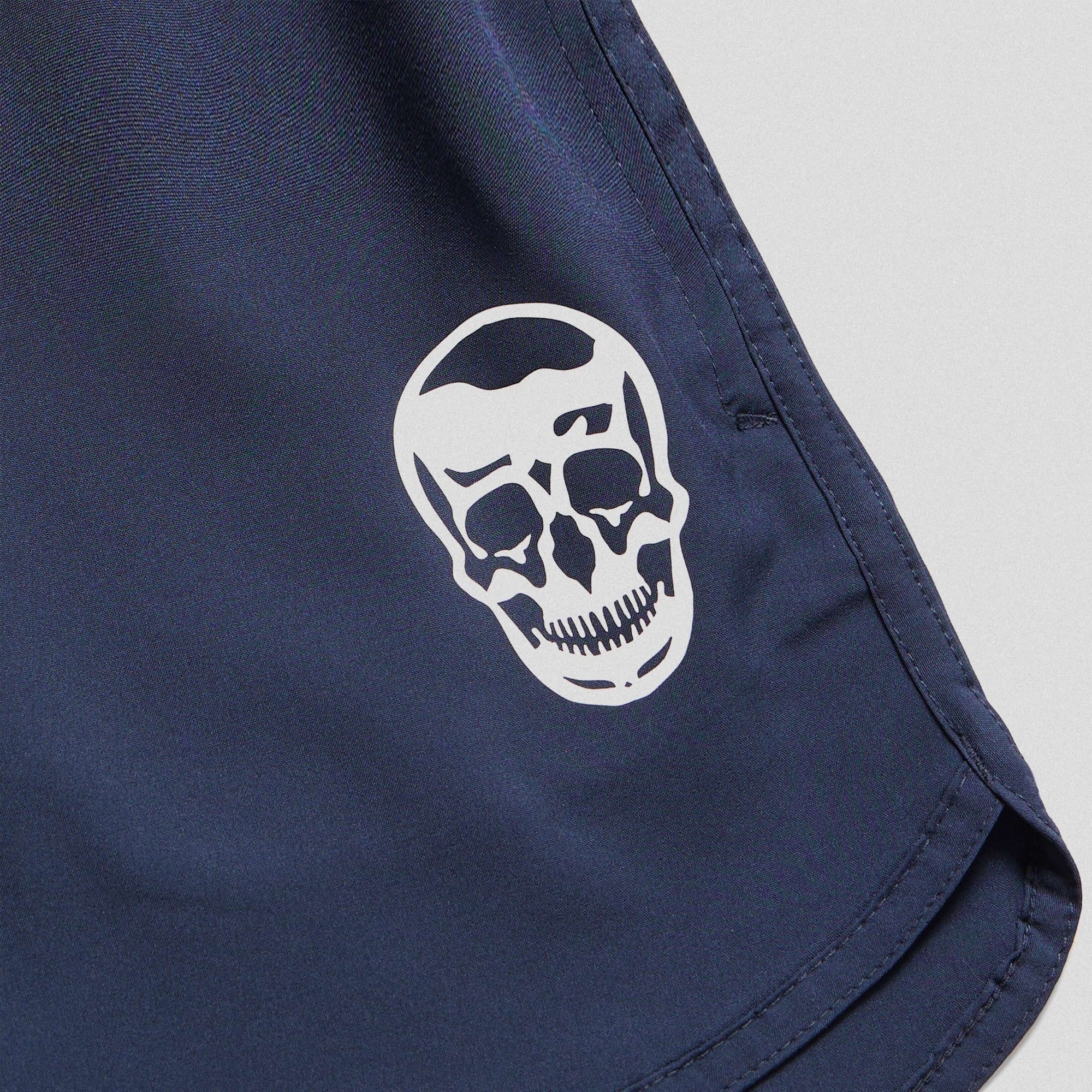 navy training shorts lay flat close up shot of logo